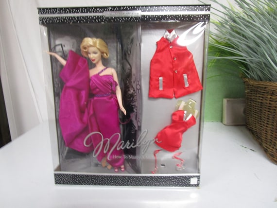 how to marry a millionaire pink dress Marilyn Monroe How to Marry a Millionaire - Your Guide to 1950s Glam