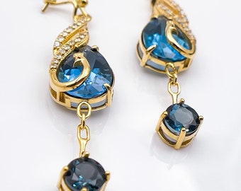 18k gold earrings Peacock design with natural vs diamond and natural London Topaz