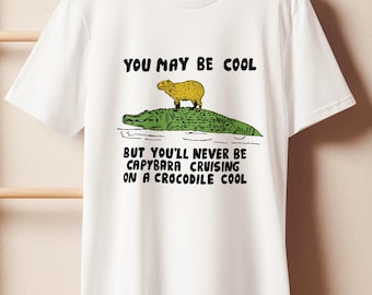 Funny Capybara Riding Crocodile T-Shirt, 100% Organic Cotton Tee, Cute Animal Meme Shirt,  Naturecore Wildlife Graphic Tee, Eco Gift, Unisex