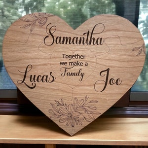May include: A wooden heart-shaped puzzle with the names Samantha, Lucas, and Joe, and the text "Together we make a family".