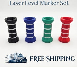May include: A set of four laser level markers in black, blue, green, and red. Each marker has a cylindrical shape with white bands. The text "Laser Level Marker Set" is displayed above the markers.