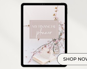 May include: A digital financial planner on a tablet screen with a pink floral background. The text "My Financial Planner" is displayed in a pink box. A button that says "Shop Now" is in the lower right corner. The text "AshleyCodesigns" is at the bottom of the screen.