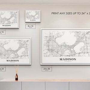 May include: A black and white map print of Madison, Wisconsin, showing the city's streets and lakes. The print is available in various sizes, up to 24 inches by 36 inches.