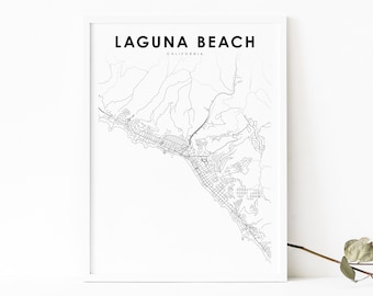 May include: A framed black and white map print of Laguna Beach, California. The map details the city's layout with roads and geographical features. The text "LAGUNA BEACH" and "CALIFORNIA" are at the top, with "MODERN LAYOUT" at the bottom.
