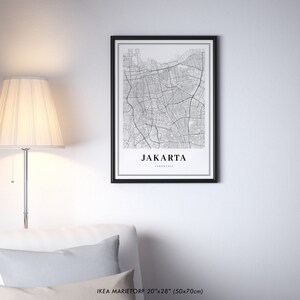 May include: Black and white map print of Jakarta, Indonesia in a black frame. The print is 20 inches by 28 inches (50x70 cm).