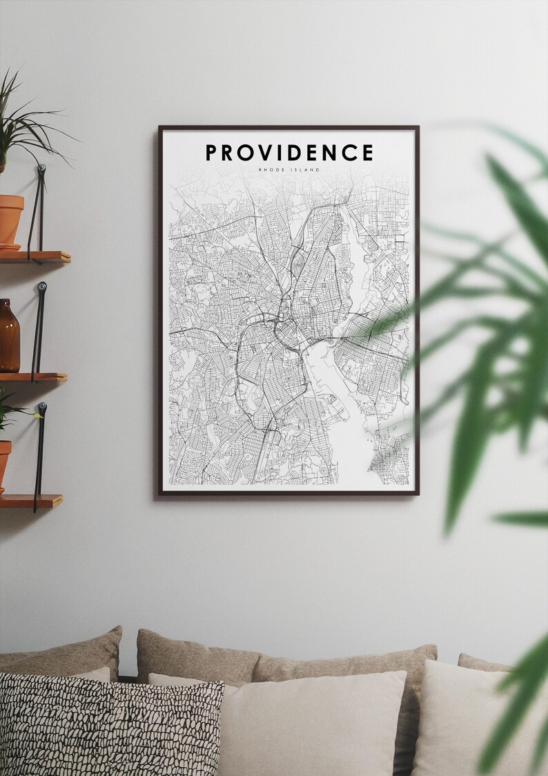 May include: A black and white map print of Providence, Rhode Island, in a black frame. The map shows the city streets and waterways. The title "PROVIDENCE RHODE ISLAND" is printed at the top of the map.