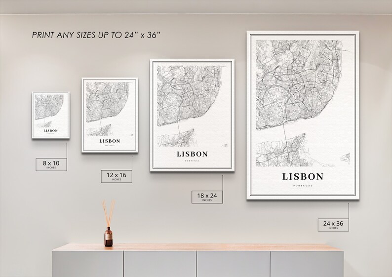 May include: A mockup of four different sizes of a black and white map print of Lisbon, Portugal. The prints are framed in white and are displayed on a white wall. The sizes are 8x10 inches, 12x16 inches, 18x24 inches, and 24x36 inches.