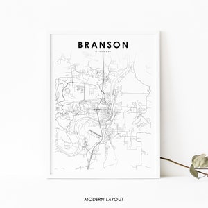May include: A black and white line art map of Branson, Missouri. The map shows the city's streets, roads, and landmarks. The text "BRANSON" and "MISSOURI" are printed in black at the top of the map. The text "MODERN LAYOUT" is printed in black at the bottom of the map.