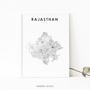 May include: A black and white line art map of Rajasthan, India. The map shows the state's roads and cities. The text "RAJASTHAN" and "INDIA" is printed in black at the top of the map.