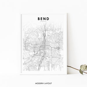 May include: A black and white line art map of Bend, Oregon. The map shows the city's streets and roads. The text "BEND OREGON" is at the top of the map. The text "MODERN LAYOUT" is at the bottom of the map.
