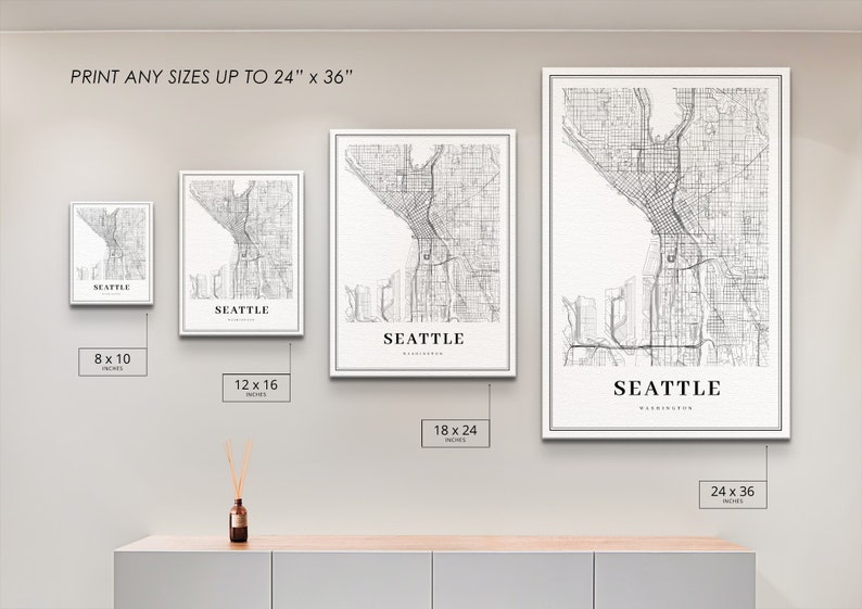 May include: Four different sizes of a black and white line art print of the city of Seattle, Washington. The print is available in sizes 8x10 inches, 12x16 inches, 18x24 inches, and 24x36 inches.