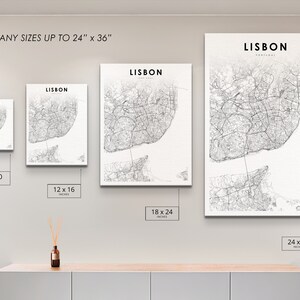 May include: A white canvas print of a black and white map of Lisbon, Portugal. The print is available in various sizes, from 8x10 inches to 24x36 inches.