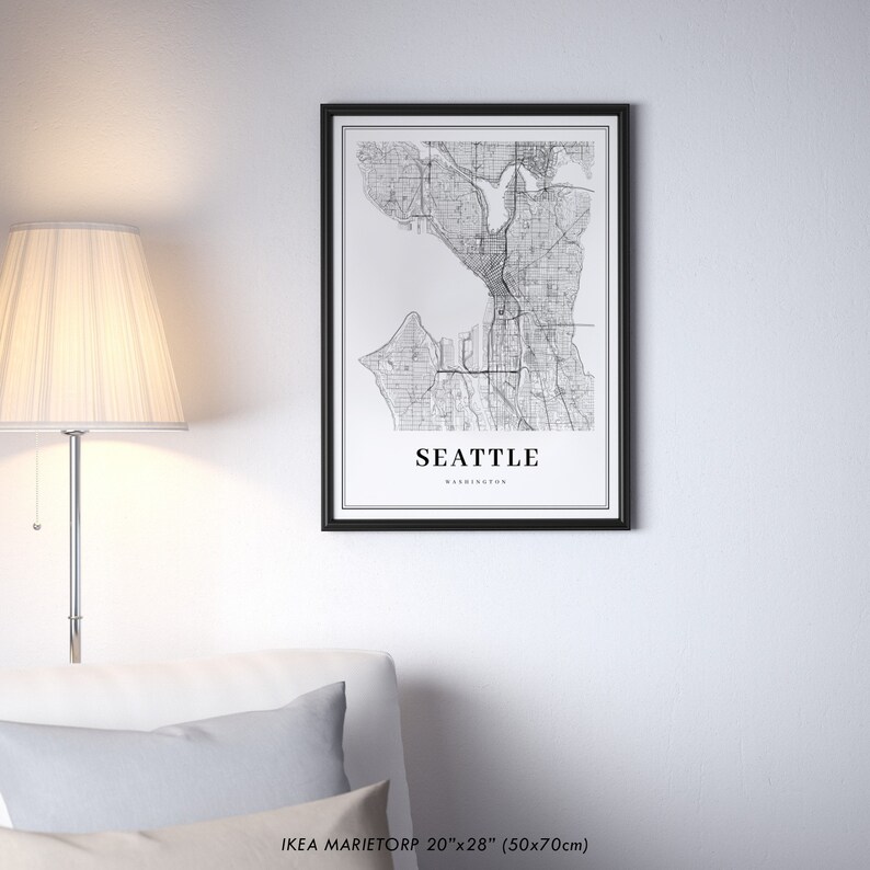 May include: Black and white map print of Seattle, Washington in a black frame. The print is 20 inches by 28 inches (50 cm by 70 cm).