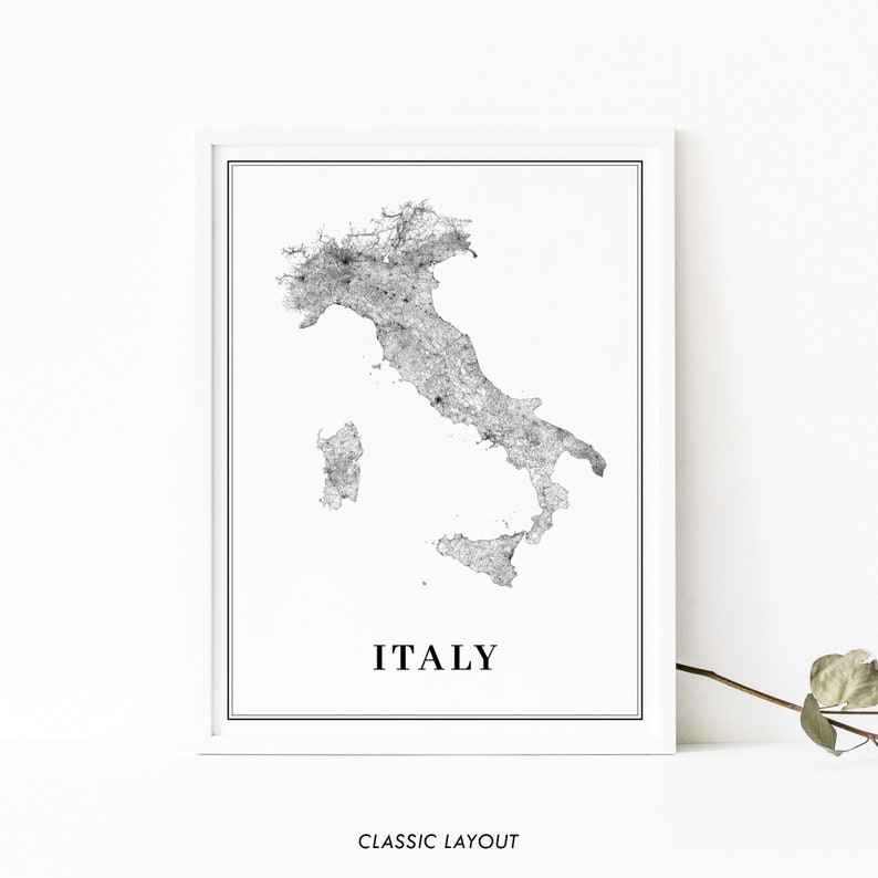 May include: A black and white map of Italy with the word "ITALY" printed below the map. The map is framed in a white frame.