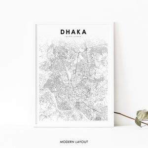 May include: A black and white map of Dhaka, Bangladesh, with the city name and country name printed at the top. The map is framed in a white frame and has a modern layout.