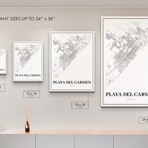 May include: Four different sizes of a black and white map print of Playa del Carmen, Mexico. The prints are framed in a white frame and are displayed on a white wall. The sizes are 8x10 inches, 12x16 inches, 18x24 inches, and 24x36 inches.