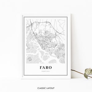 May include: A black and white map print of Faro, Portugal. The map shows the city's streets and waterways. The city name "Faro" and "Portugal" are printed below the map.