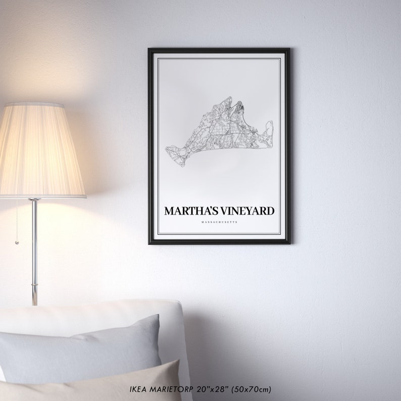 May include: Black and white line art print of Martha's Vineyard, Massachusetts. The print is framed in a black frame and measures 20 inches by 28 inches.