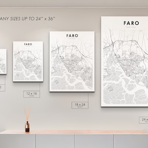 May include: A white wall with four different sized prints of a map of Faro, Portugal. The prints are 8x10 inches, 12x16 inches, 18x24 inches, and 24x36 inches. The text "PRINT ANY SIZES UP TO 24" x 36" is at the top of the image.