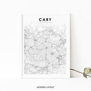 May include: A black and white map print of Cary, North Carolina, with the city name and state printed at the top. The text "MODERN LAYOUT" is printed at the bottom of the image.