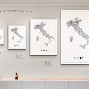 May include: Four different sizes of a black and white print of a map of Italy. The print is available in 8x10 inches, 12x16 inches, 18x24 inches, and 24x36 inches. The text "ITALY" is printed below the map on each print.