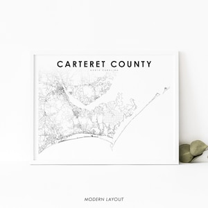 May include: A black and white map of Carteret County, North Carolina. The map shows the county's roads, waterways, and coastline. The text 'Carteret County' and 'North Carolina' is printed in black at the top of the map. The text 'Modern Layout' is printed in black at the bottom of the map.