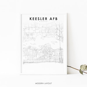May include: A framed black and white map print of Keesler AFB, Mississippi. The print features a detailed street map with the text "Keesler AFB" at the top and "Modern Layout" at the bottom.