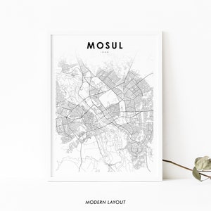 May include: A black and white line art map of Mosul, Iraq. The map is printed on white paper and framed in a white frame. The text "Mosul, Iraq" is printed at the top of the map. The text "Modern Layout" is printed at the bottom of the map.