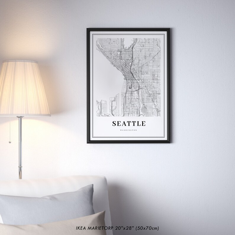 May include: Black and white map print of Seattle, Washington in a black frame. The print is 20 inches by 28 inches (50x70 cm).