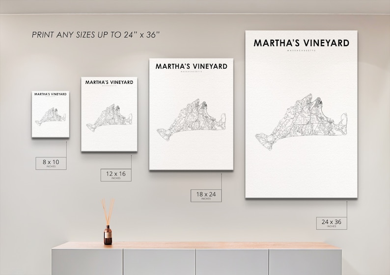 May include: A white wall with four framed prints of a black and white map of Martha's Vineyard. The prints are in different sizes: 8x10 inches, 12x16 inches, 18x24 inches, and 24x36 inches. The text "PRINT ANY SIZES UP TO 24" x 36" is at the top of the wall. The text "MARTHA'S VINEYARD" is at the top of each print.