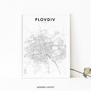 May include: A black and white line art map of Plovdiv, Bulgaria. The map shows the city's streets and landmarks. The text "Plovdiv, Bulgaria" and "Modern Layout" are printed below the map.