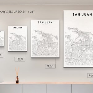 May include: A white wall with four different sized prints of a map of San Juan, Puerto Rico. The prints are 8x10 inches, 12x16 inches, 18x24 inches, and 24x36 inches.