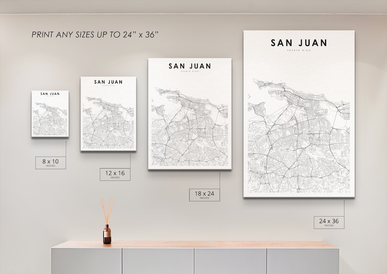 May include: A white wall with four different sized prints of a map of San Juan, Puerto Rico. The prints are 8x10 inches, 12x16 inches, 18x24 inches, and 24x36 inches.