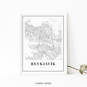 May include: Black and white line art map print of Reykjavik, Iceland. The map shows the city streets and surrounding water. The text "REYKJAV&Iacute;K" and "ICELAND" is printed below the map.