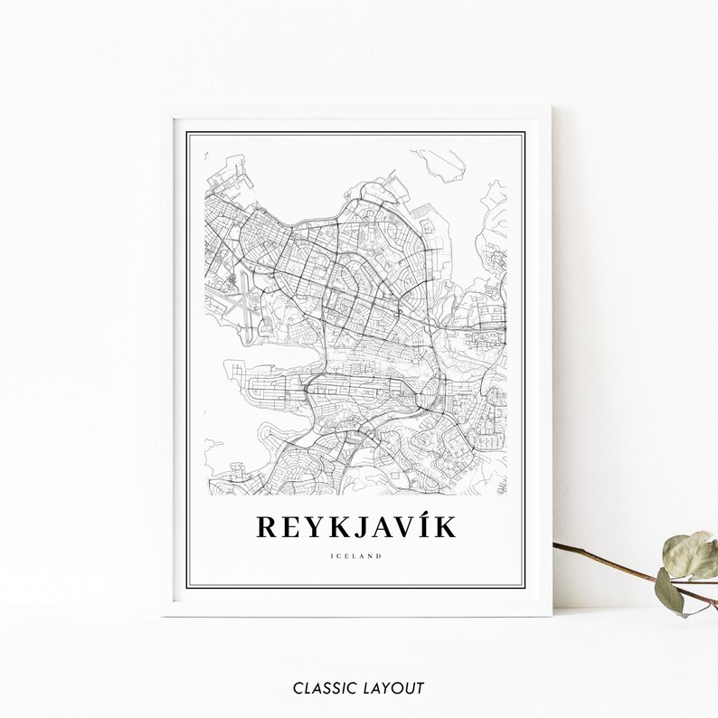 May include: Black and white line art map print of Reykjavik, Iceland. The map shows the city streets and surrounding water. The text "REYKJAV&Iacute;K" and "ICELAND" is printed below the map.