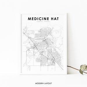 May include: A black and white map print of Medicine Hat, Alberta, Canada. The map shows the city's streets and landmarks. The text "MEDICINE HAT" and "ALBERTA, CANADA" is printed at the top of the map. The text "MODERN LAYOUT" is printed at the bottom of the map.