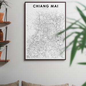 May include: A black and white map print of Chiang Mai, Thailand, in a black frame. The map shows the city's streets and landmarks.