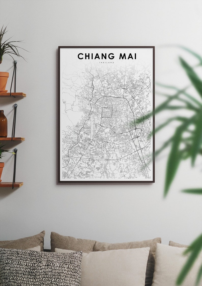May include: A black and white map print of Chiang Mai, Thailand, in a black frame. The map shows the city's streets and landmarks.