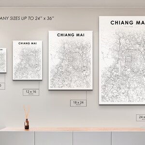 May include: A white wall with four different sized prints of a black and white map of Chiang Mai, Thailand. The prints are 8x10 inches, 12x16 inches, 18x24 inches, and 24x36 inches.