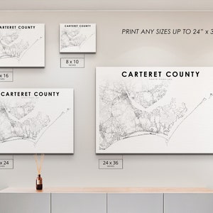 May include: Four different sizes of a black and white map print of Carteret County, North Carolina. The print sizes are 8x10 inches, 12x16 inches, 18x24 inches, and 24x36 inches. The text 'PRINT ANY SIZES UP TO 24' x 36' is at the top of the image.