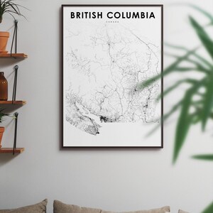 May include: A black and white line art map of British Columbia, Canada, in a black frame on a white wall.