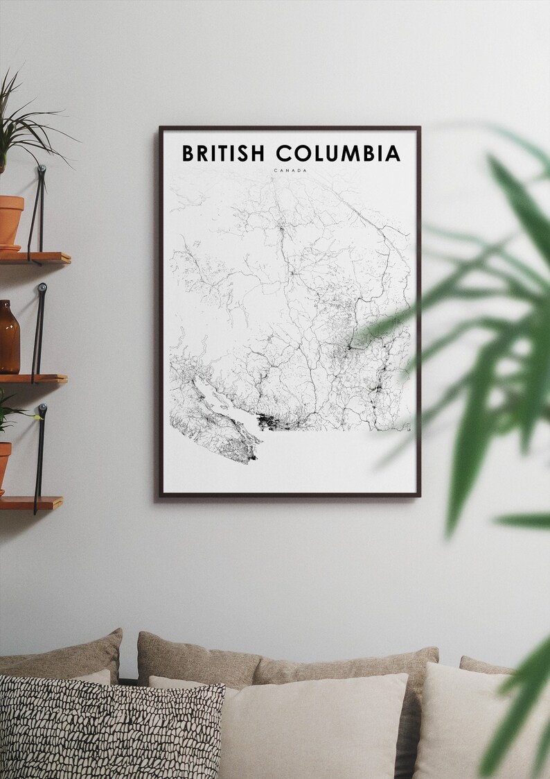 May include: A black and white line art map of British Columbia, Canada, in a black frame on a white wall.