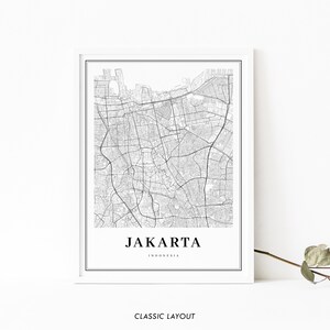 May include: Black and white map print of Jakarta, Indonesia. The map shows the city's streets and landmarks. The text "JAKARTA" and "INDONESIA" is printed below the map.
