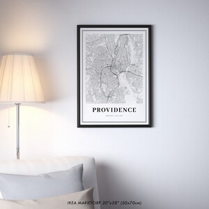 May include: Black and white map print of Providence, Rhode Island, in a black frame. The print is 20 inches by 28 inches (50 cm by 70 cm).