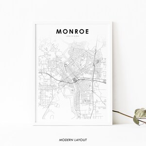 May include: A black and white map of Monroe, Louisiana, with the city name and state printed at the top. The map is in a white frame and has the text "MODERN LAYOUT" printed below the map.