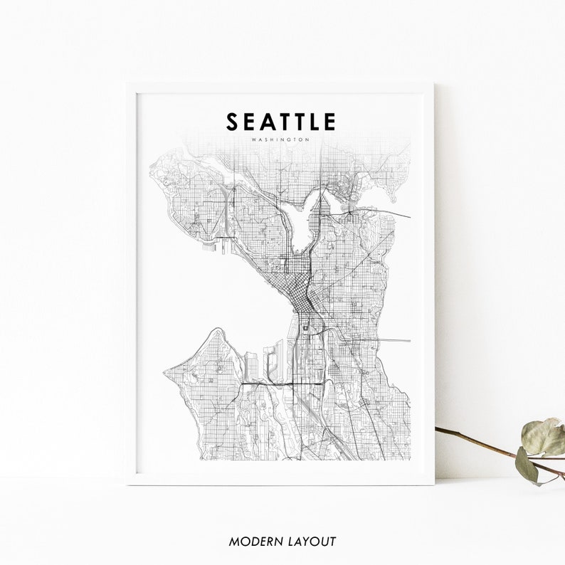 May include: A black and white line art map of Seattle, Washington. The map shows the city's streets and waterways. The text "Seattle" and "Washington" are printed above the map. The text "Modern Layout" is printed below the map.