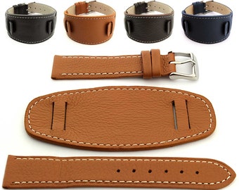 May include: A brown leather watch strap with white stitching. The strap is made up of three pieces: a long strap, a short strap, and a buckle. The strap is designed to be used with a watch that has a lug width of 22mm.