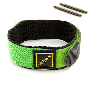 May include: Green and black nylon watch strap with a velcro closure. The strap has a black label with the word "SPORT" in yellow lettering.