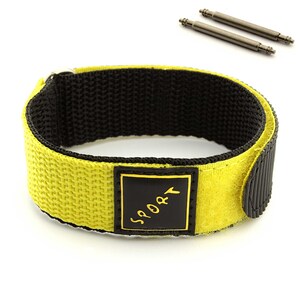 May include: Yellow watch band with black velcro closure and a black square label that says "SPORT" in gold lettering.