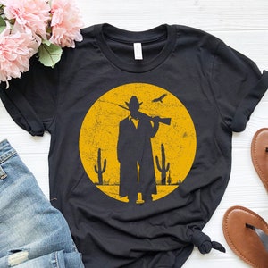 Maglietta retrò da cowboy al tramonto / Maglietta vintage western / Regalo da cowboy / Maglietta del selvaggio West / Maglietta da rodeo del Texas / Regalo da film western